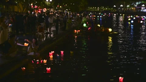 The Magic of Hoi An: Tourists Participating in the Lantern Ritual Stock Footage 296244492