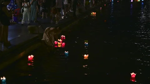 The Magic of Hoi An: Tourists Participating in the Lantern Ritual Stock Footage 296245855
