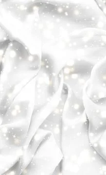 Magic holiday white soft silk flatlay background texture with glowing snow, l Stock Photos