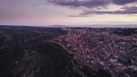 Magic hour sunset aerial over the Ancient Jerusalem looking city of Matera Video stock 241186356