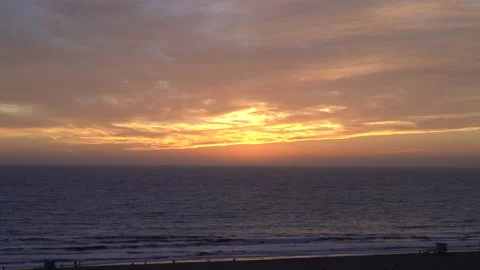 Magic hour sunset over ocean.  Birds on water. Stock Footage 189945917