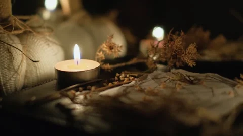 Magic items for witchcraft or divination by burning candles, close-up Stock Footage 241236489