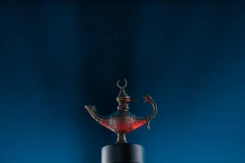 Magic lantern on blue background Stock Photos