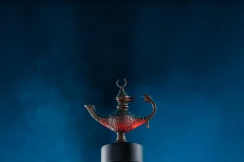 Magic lantern on blue background with smoke like cloud Stock Photos