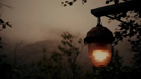 Magic lantern at dusk with the mountains in the background Stock Footage 122496114