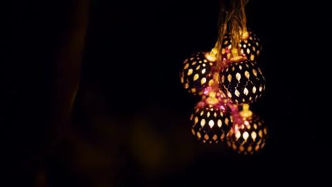 Magic lanterns spin and give beautiful glare to the walls. New Year glowing Stock Photos