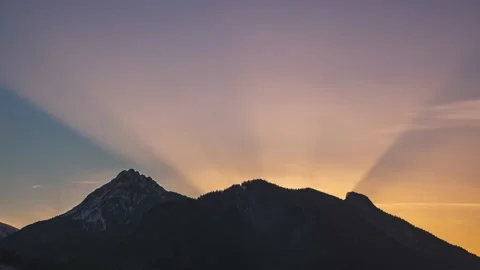 Magic light of sun sky above alps mountains nature at colorful sunset Time lapse Stock Footage 168832660