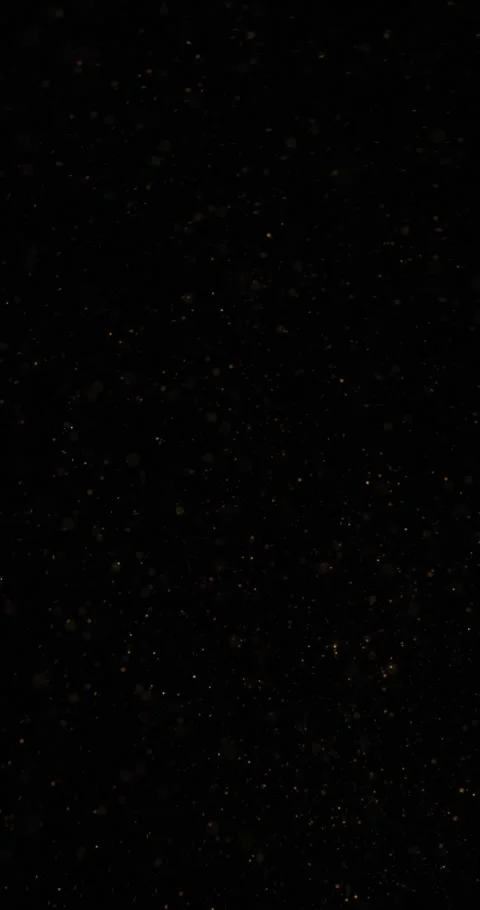 Magic loop cloud of golden dots random flying on vertical black background Stock Footage 346650970
