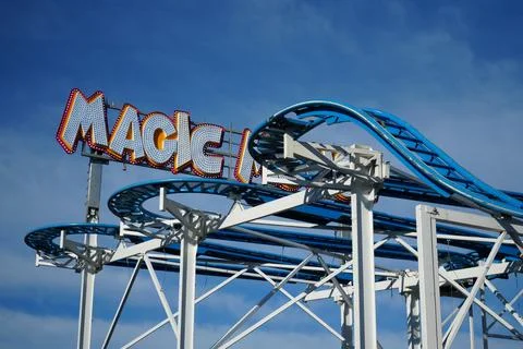 Magic Mouse roller coaster sign and blue track at Goose Fair Nottingham Stock Photos