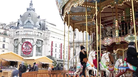 Magic in Paris Carousel Adds Festive Glow to Hotel de Ville Square 12.11.2022 Stock Footage 284649895