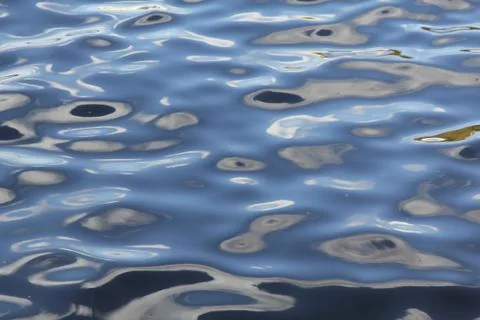 The magic picture created by the sky, clouds and the sun on the water Stock Photos