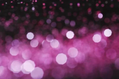 Magic pink bokeh effect on dark background Stock Photos