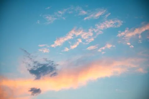 Magic pink cumulus clouds in blue sky, sunset, sunrise, nature background, .. Stock Photos