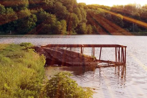 Magic pond. Composition of a pond and rays Foto stock