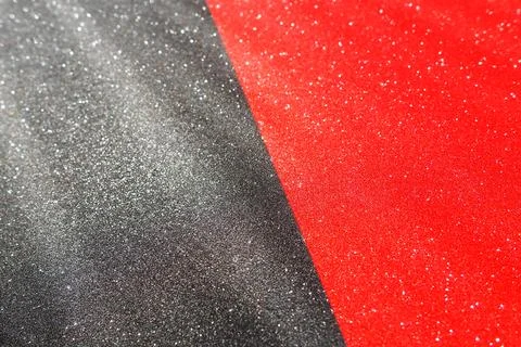 Magic rays of light on black red surface. Bokeh, dust particles, reflection and Foto stock