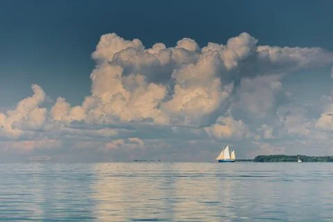 Magic reflections on water surface, sailing regatta in the Gulf of Finland at Stock Photos