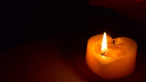 Magic, sorcery. The hand appears above the candle. Stock-Footage 126577463