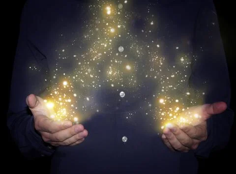Magic sparkles in hands Stock Photos