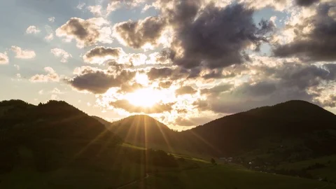 Magic sunrise with sun and clouds over mountains Time lapse Stock-Footage 105013581