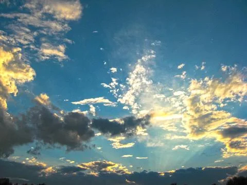 Magic sunset. Beautiful dark clouds at sunset after a thunderstorm. Dramatic Stock Photos