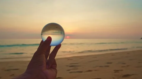 Magic sunset view in a crystal ball on your hand. Stock Footage 153556407