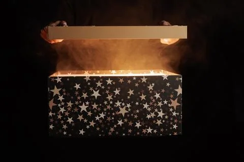 Magic surprise box on dark background with smoke, discount and sales concep.. Stock Photos