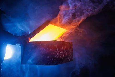 Magic surprise box on dark background with smoke, discount and sales concep.. Stock Photos