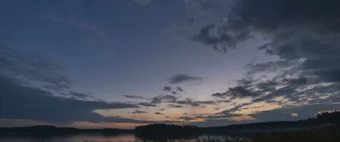 Magic timelapse day to night with moving clouds over the forest lake Stock Footage 158119962