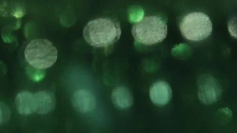 The magic of this video's glow is the dark and light green bokeh. Stock-Footage 317536248