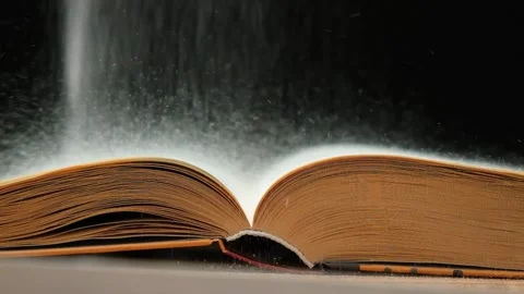 Magic vintage book of knowledge on black background slow motion. Stock Footage 265556049