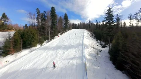 The magic of winter from an FPV drone: skiers and snowboarders on Solisko Stock Footage 331335210