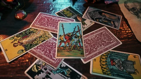 Magic witchcraft seance forecasting conflict with the Five of Wands tarot card Stock Footage 251184696