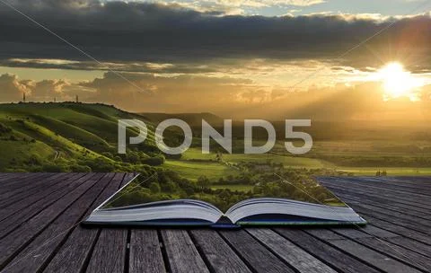 Magical book with contents spilling into landscape background Stock Illustration