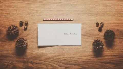 Magical christmas theme background, pine cones and christmas card on w Stock Photos