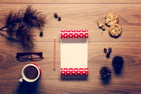 Magical christmas theme background, pine cones, coffee, cookies and an empty  Stock Photos