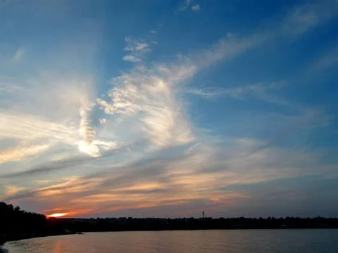 The magical cloud game in the sunset over the sea. Stock Photos