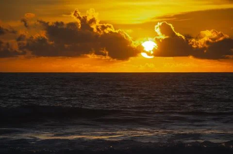 Magical dramatic sunset on a tropical beach. Stock Photos