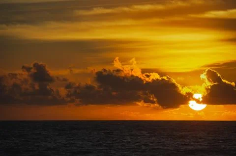 Magical dramatic sunset on a tropical beach. Stock Photos