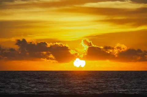 Magical dramatic sunset on a tropical beach. Stock Photos