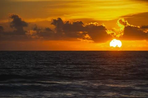 Magical dramatic sunset on a tropical beach. Stock Photos