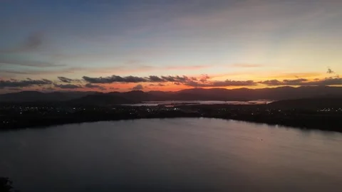 Magical Dusk: A Panoramic Sunset Over a Lagoon in Garopaba, Brazil Stock Footage 317100336