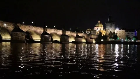 Magical evening landscape with the waves of Vltava under the bridge in the ol Stock Footage 83317380