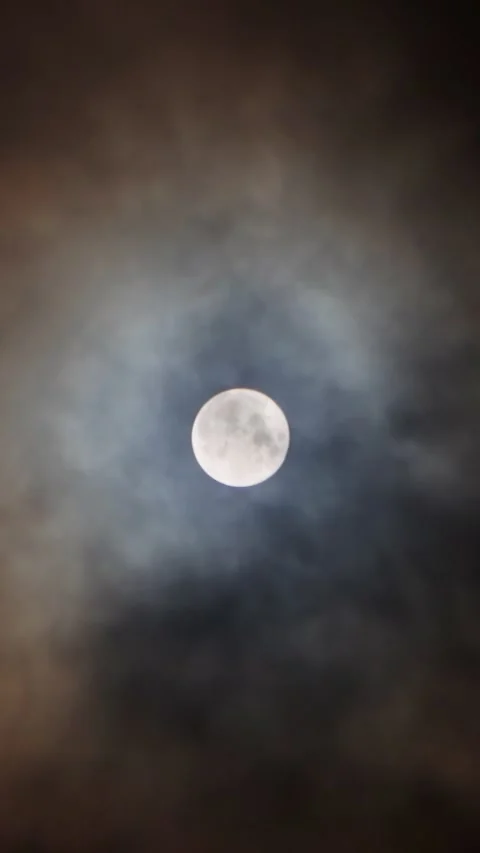 A magical full moon in the night sky with clouds. Video stock 293138063
