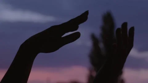 Magical hands dancing sunset Stock Footage 135585929