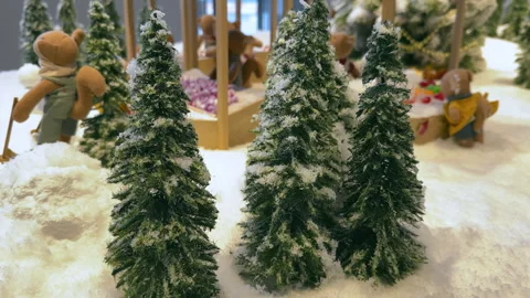 Magical Miniatures: Tiny Christmas Trees in a Snowy Setting Stock Footage 257699366