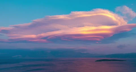 Magical movement of lenticular clouds and the appearance of the moon Stock Footage 156968545