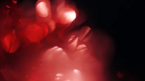 Magical red light leakson the left side of the frame alternately flicker in the Vídeos de archivo 102239894