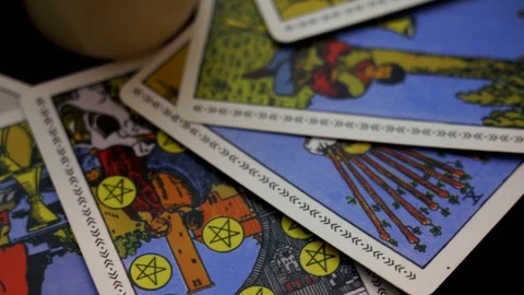 A magical ritual using tarot cards around two white candles. Esoteric concept. Stock Footage 108023407