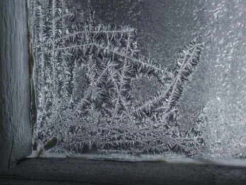 Magical snowflakes on a window Stock Photos