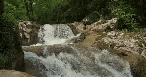 A magical stream with waterfalls and rapids in slow motion Stock Footage 341832783